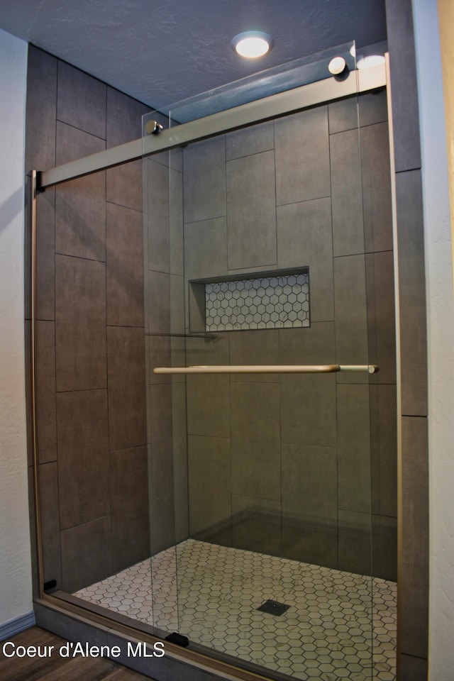 full bathroom with a shower stall