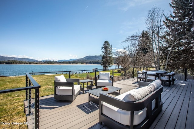 475 Campbell Point Rd, Laclede, ID 83841 - wooden terrace featuring a water and mountain view, an outdoor living space, a yard, and outdoor dining area