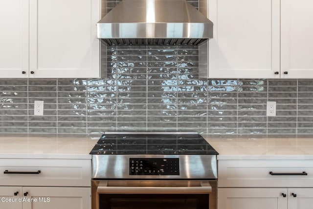 475 Campbell Point Rd, Laclede, ID 83841 - kitchen with electric range, wall chimney range hood, backsplash, and white cabinets