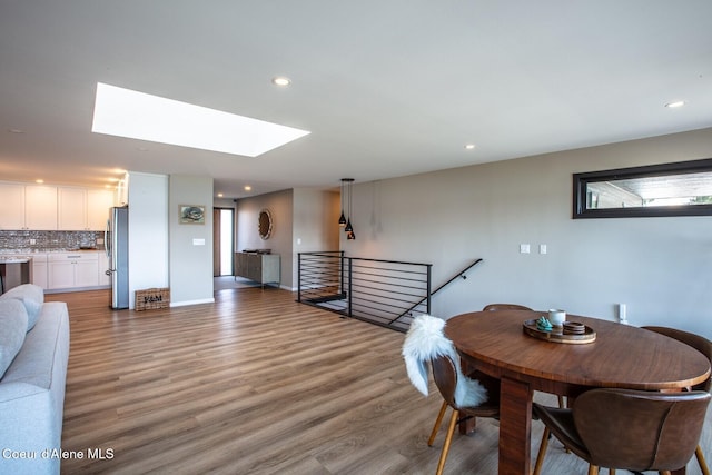 475 Campbell Point Rd, Laclede, ID 83841 - dining area featuring light wood-style flooring, a skylight, recessed lighting, and baseboards