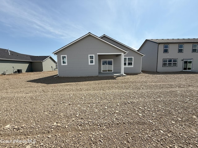 5181 E Aquila Ave, Post Falls, ID 83854 - rear view of house with central AC unit