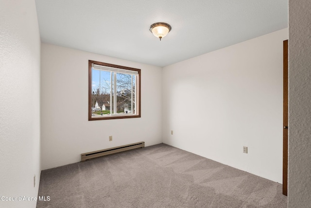 empty room with baseboard heating and carpet floors