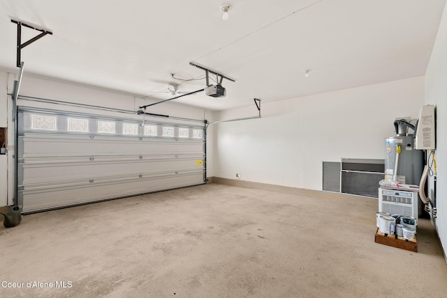 garage featuring water heater and a garage door opener