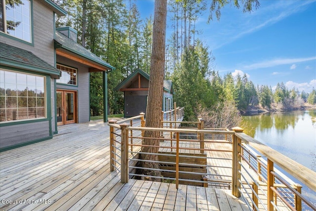 wooden deck featuring a water view