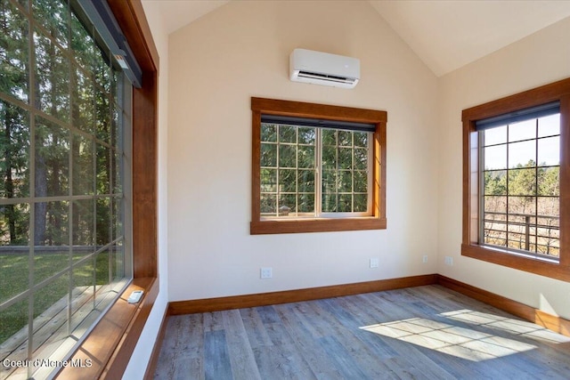 unfurnished sunroom featuring a wall unit AC