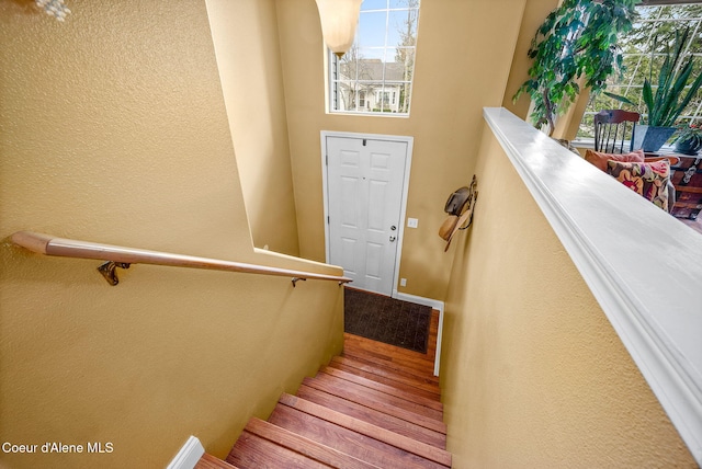 2790 W Versailles Dr, Coeur Dalene, ID 83815 - stairs featuring a textured wall and wood finished floors