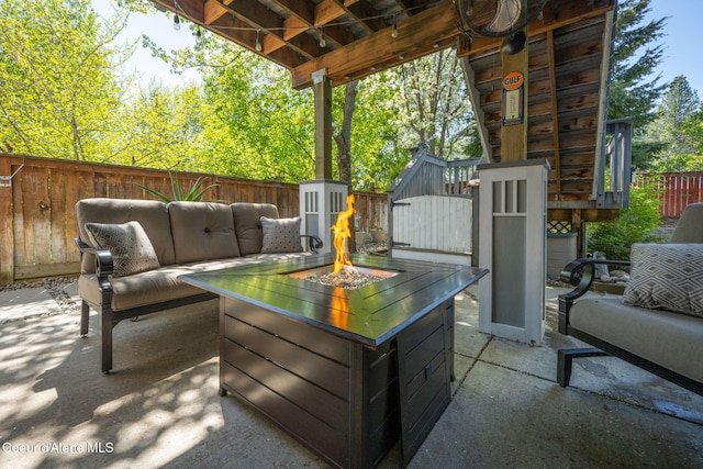 2790 W Versailles Dr, Coeur Dalene, ID 83815 - view of patio / terrace with an outdoor living space with a fire pit and a fenced backyard