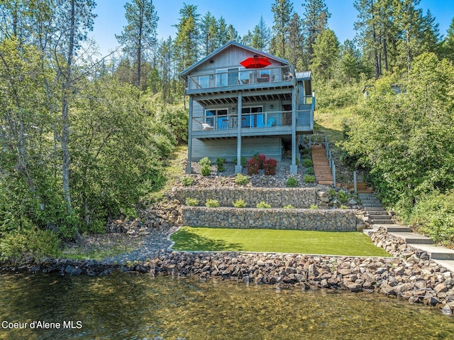1967 W Cottonwood Rd, Worley, ID 83876 - back of property featuring a balcony, a lawn, and stairs