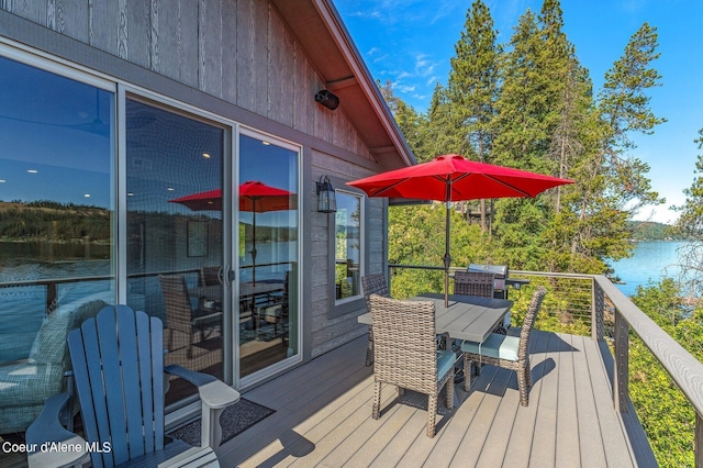 1967 W Cottonwood Rd, Worley, ID 83876 - wooden deck with outdoor dining space and a water view