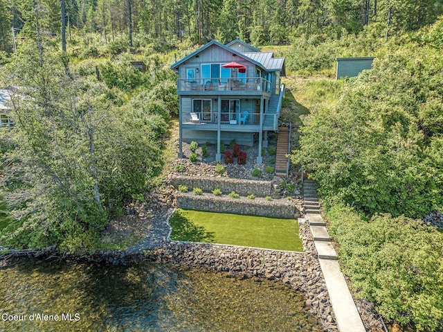 1967 W Cottonwood Rd, Worley, ID 83876 - exterior space with a view of trees, stairway, a standing seam roof, metal roof, and a lawn