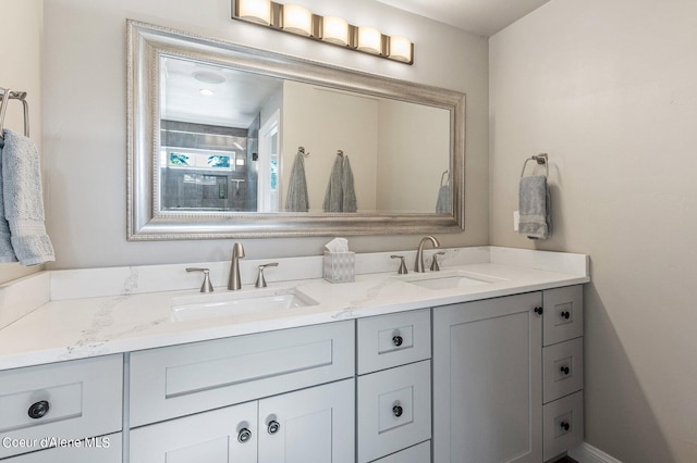 1967 W Cottonwood Rd, Worley, ID 83876 - full bathroom featuring double vanity, baseboards, and a sink