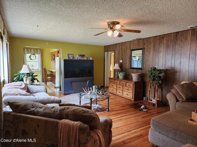 216 W Oak Ave, Osburn, ID 83849 - living area with a ceiling fan, wood finished floors, and a textured ceiling