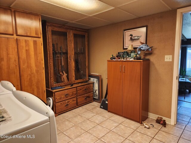 216 W Oak Ave, Osburn, ID 83849 - interior space with light tile patterned floors, baseboards, and a paneled ceiling