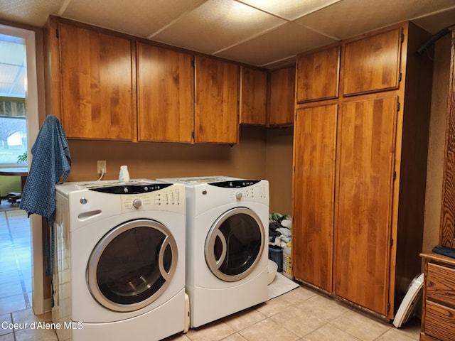 216 W Oak Ave, Osburn, ID 83849 - laundry area featuring light tile patterned floors, independent washer and dryer, and cabinet space