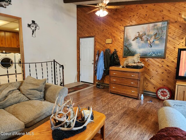 216 W Oak Ave, Osburn, ID 83849 - living area featuring wood walls, separate washer and dryer, ceiling fan, and wood finished floors