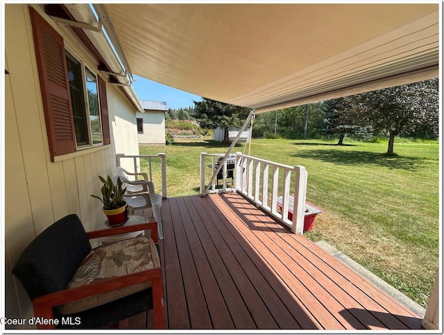 deck featuring a yard
