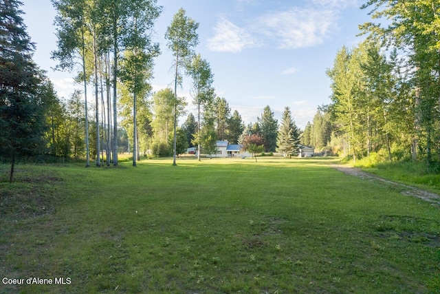 view of home's community featuring a lawn