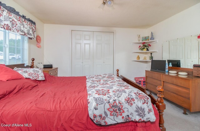 carpeted bedroom featuring a closet