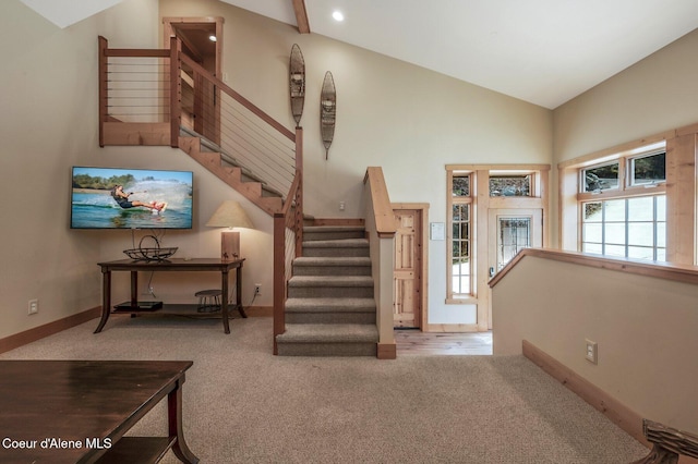 3765 Bottle Bay Rd, Sagle, ID 83860 - staircase with high vaulted ceiling, carpet flooring, and baseboards