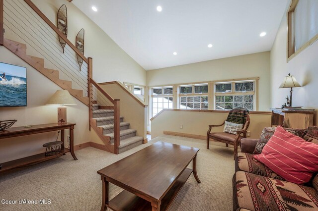 3765 Bottle Bay Rd, Sagle, ID 83860 - living room with high vaulted ceiling, recessed lighting, baseboards, and carpet floors