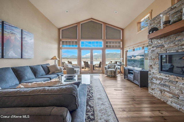 3765 Bottle Bay Rd, Sagle, ID 83860 - living area featuring hardwood / wood-style floors and high vaulted ceiling