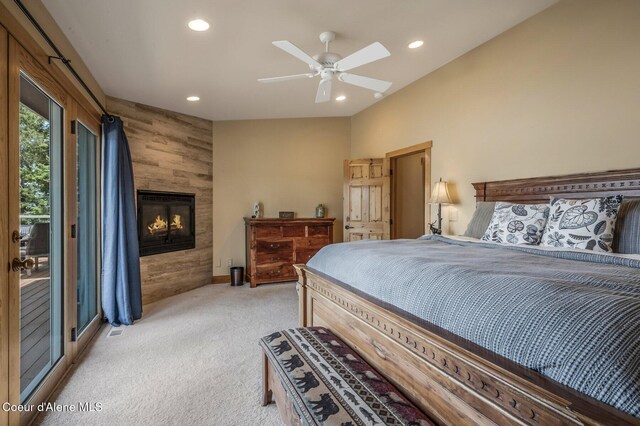 3765 Bottle Bay Rd, Sagle, ID 83860 - bedroom featuring access to exterior, light colored carpet, a fireplace, and recessed lighting