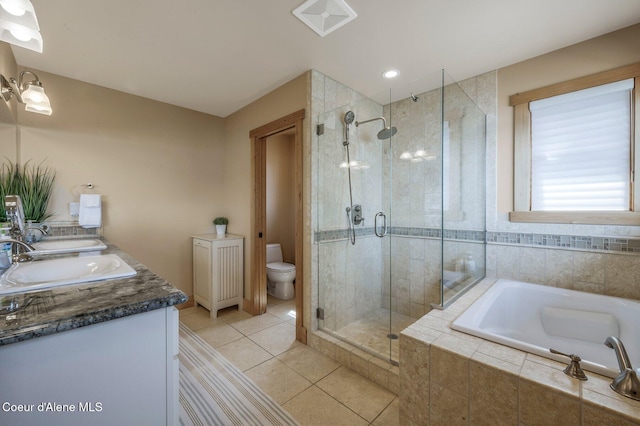 3765 Bottle Bay Rd, Sagle, ID 83860 - full bathroom with a stall shower, tile patterned floors, a garden tub, toilet, and a sink