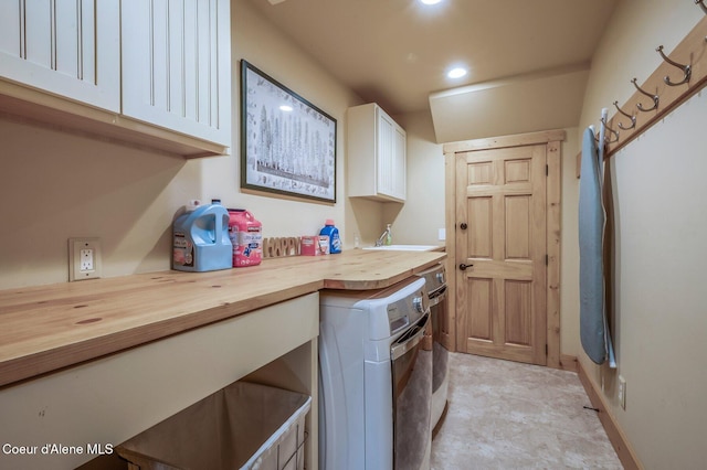 3765 Bottle Bay Rd, Sagle, ID 83860 - clothes washing area with recessed lighting, washer and clothes dryer, a sink, and cabinet space