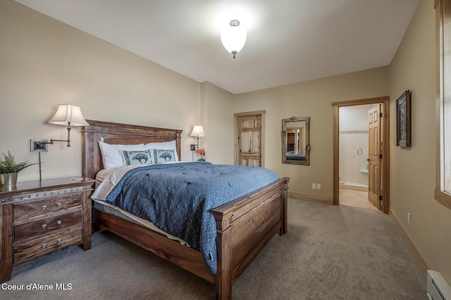 3765 Bottle Bay Rd, Sagle, ID 83860 - carpeted bedroom featuring baseboard heating, ensuite bathroom, and baseboards