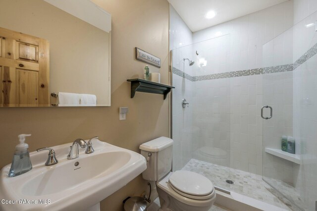 3765 Bottle Bay Rd, Sagle, ID 83860 - full bath featuring a sink, toilet, and a stall shower