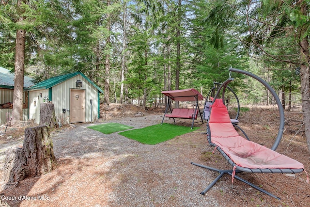 view of yard with a storage shed and an outdoor structure
