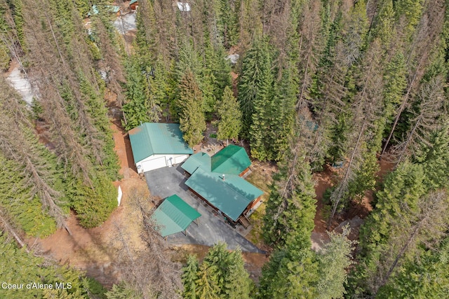 drone / aerial view featuring a view of trees