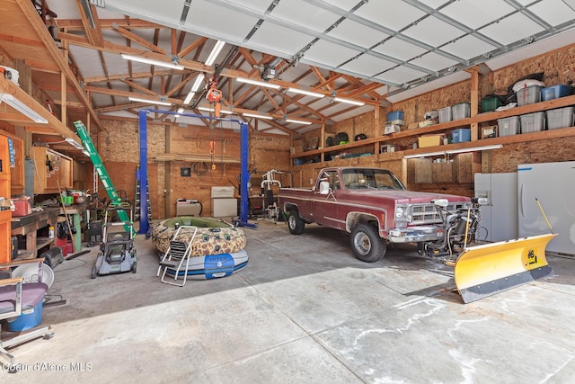 garage with freestanding refrigerator