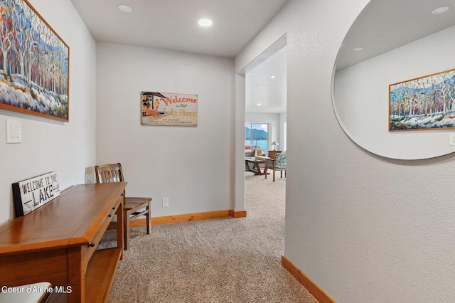 hall with baseboards, recessed lighting, and carpet flooring