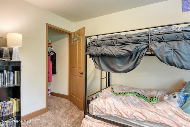 bedroom with carpet and baseboards