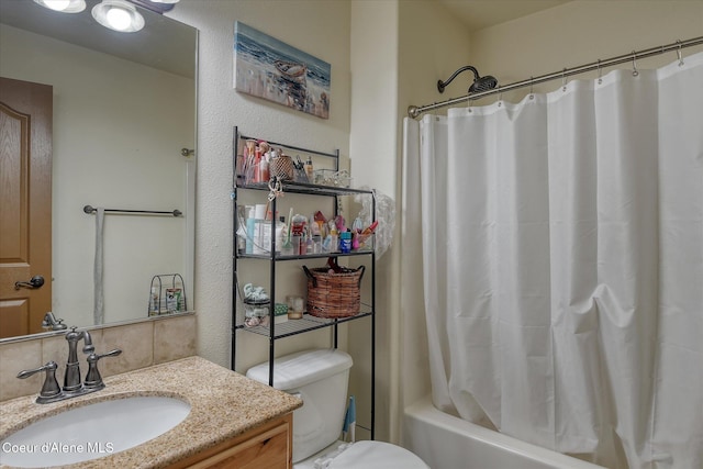 bathroom featuring toilet, vanity, and shower / bathtub combination with curtain