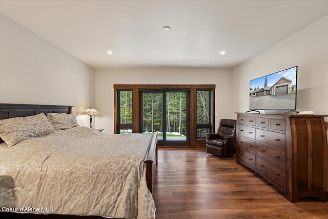 bedroom with access to outside, recessed lighting, and dark wood finished floors
