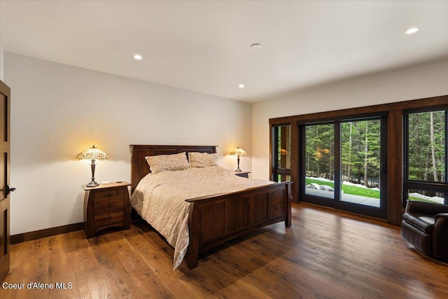 bedroom featuring access to outside, wood finished floors, baseboards, and recessed lighting