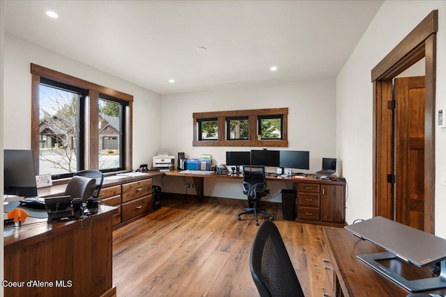 home office featuring light wood-type flooring and recessed lighting