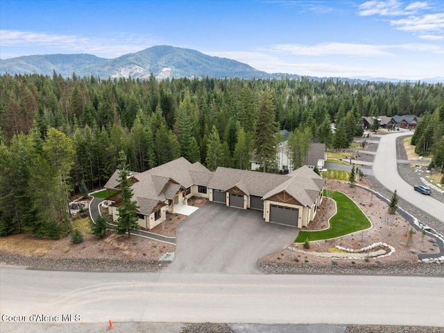 bird's eye view featuring a mountain view and a forest view