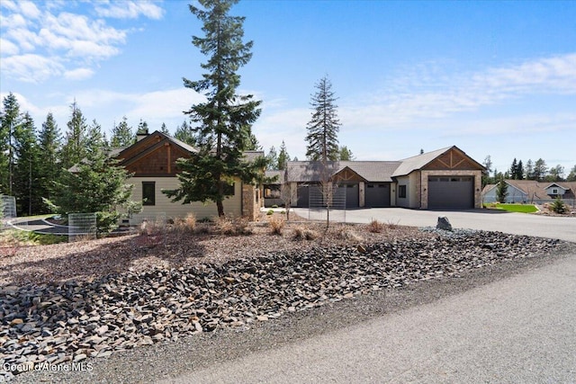 view of front of home with an attached garage and concrete driveway