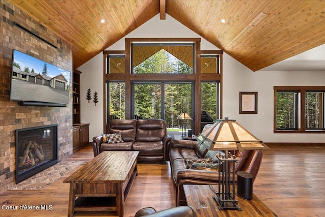 living room with plenty of natural light, hardwood / wood-style flooring, and wood ceiling