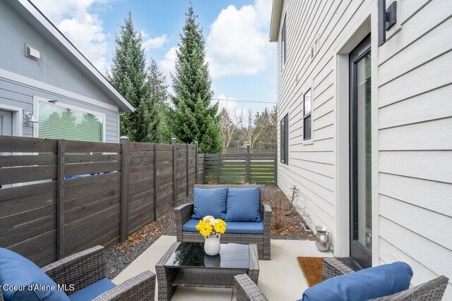 3242 N Rosalia Rd, Coeur Dalene, ID 83814 - view of patio / terrace with a fenced backyard and an outdoor living space