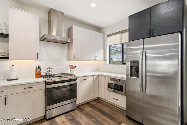 3242 N Rosalia Rd, Coeur Dalene, ID 83814 - kitchen with wall chimney range hood, light countertops, backsplash, dark wood-type flooring, and stainless steel appliances