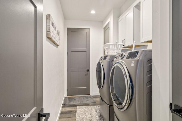 3242 N Rosalia Rd, Coeur Dalene, ID 83814 - clothes washing area with separate washer and dryer, baseboards, recessed lighting, cabinet space, and wood finished floors