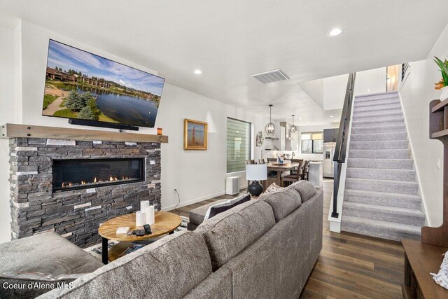 3242 N Rosalia Rd, Coeur Dalene, ID 83814 - living room featuring a fireplace, recessed lighting, stairs, visible vents, and dark wood finished floors