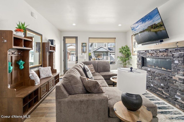 3242 N Rosalia Rd, Coeur Dalene, ID 83814 - living area with recessed lighting, a stone fireplace, and wood finished floors