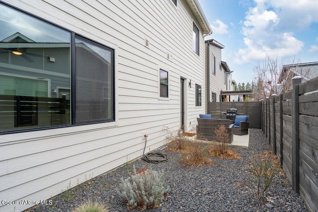 3242 N Rosalia Rd, Coeur Dalene, ID 83814 - view of side of property with a fenced backyard and a patio area