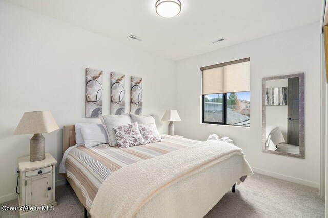 3242 N Rosalia Rd, Coeur Dalene, ID 83814 - bedroom with baseboards, visible vents, and carpet floors