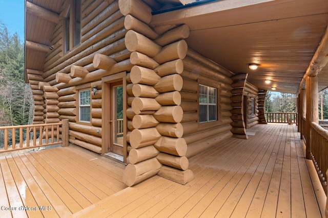 wooden terrace featuring a porch